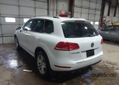 2014 Volkswagen Touareg 3.6L Executive z USA, uszkodzony, nr VIN WVGEF9BP7ED010507